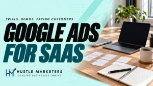 Google Ads for SaaS cover showing two laptops, blank planning cards, a notebook and a coffee cup on a workspace.